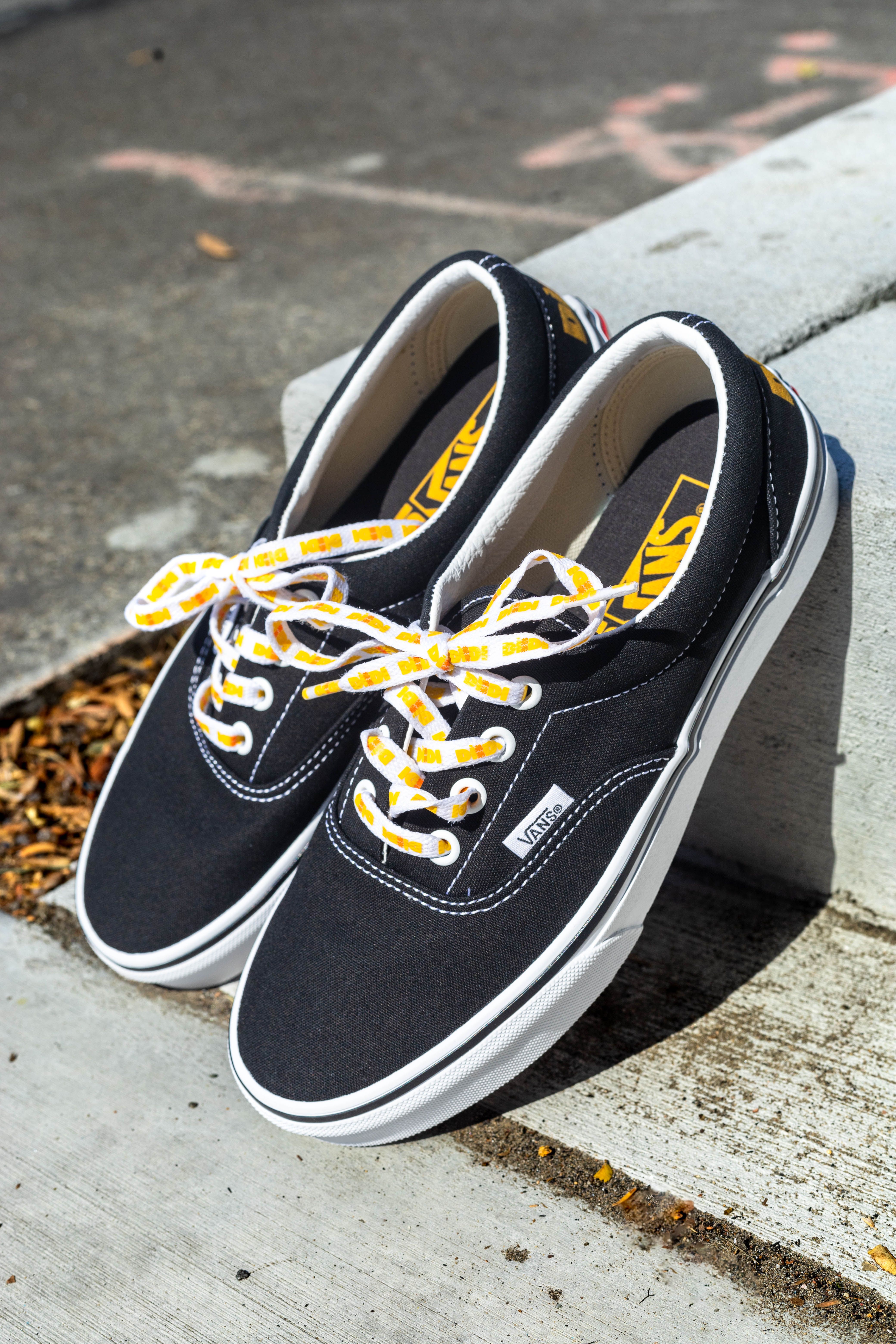 Black vans with yellow laces online