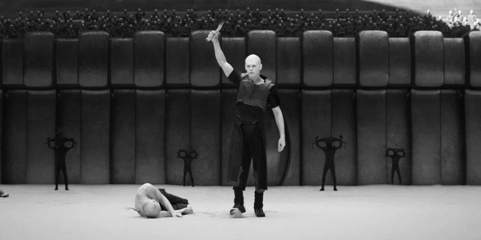 Austin Butler as Feyd-Rautha on the Harkonnen Planet holding up a knife in Dune: Part Two