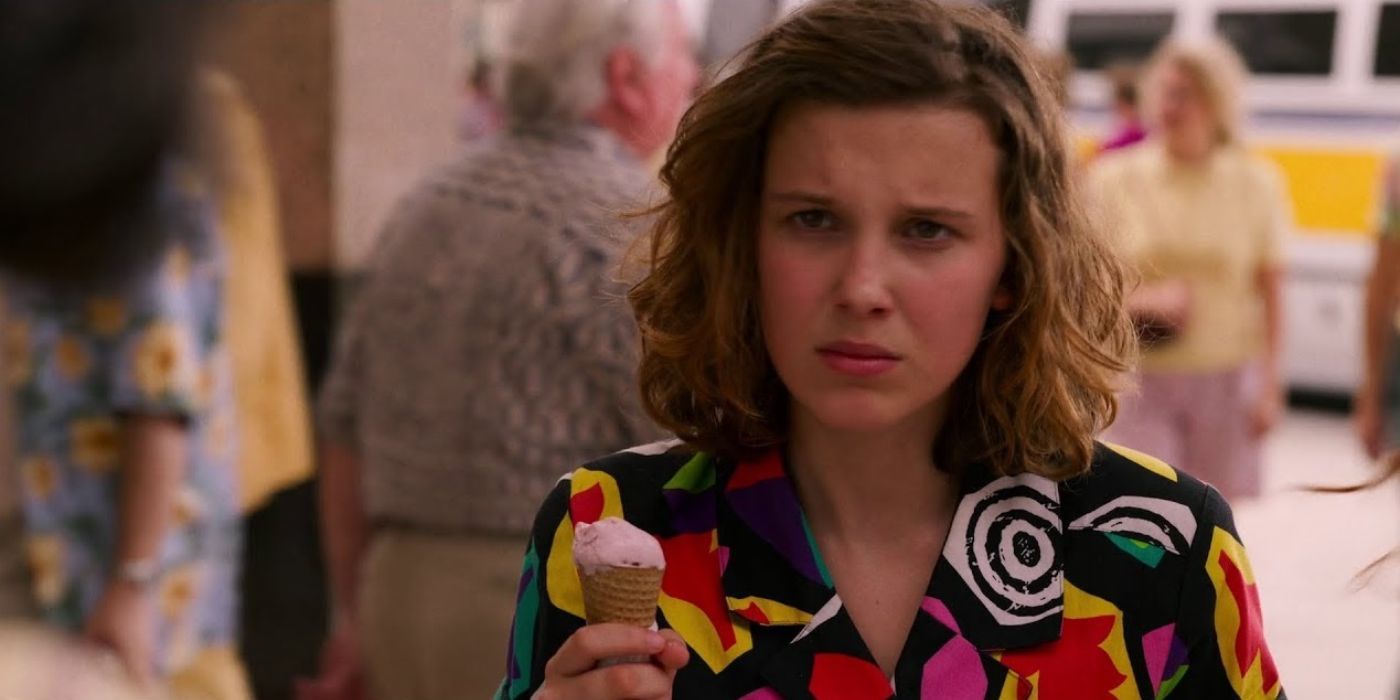 Eleven (Millie Bobby Brown) holds an ice cream cone and is clearly upset in 'Stranger Things'