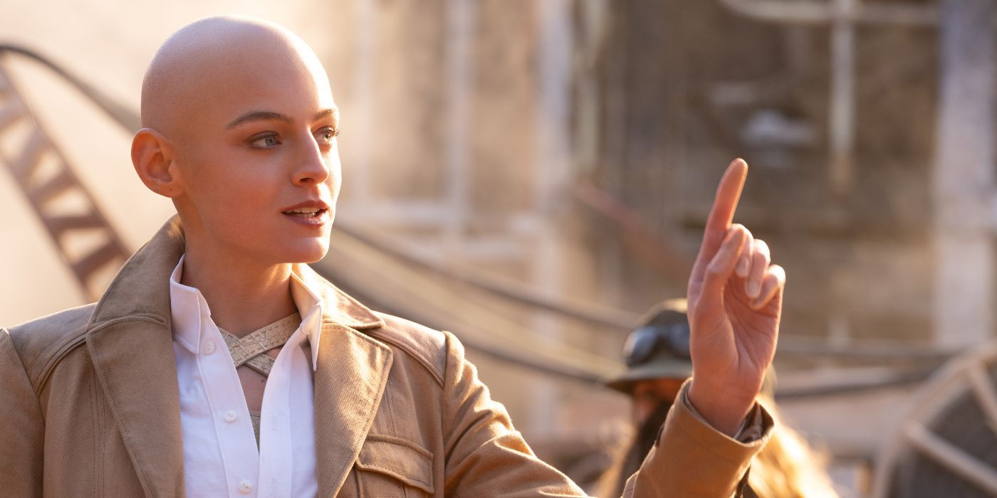 Emma Corrin as Cassandra Nova in Deadpool &amp; Wolverine, holding up their index finger.