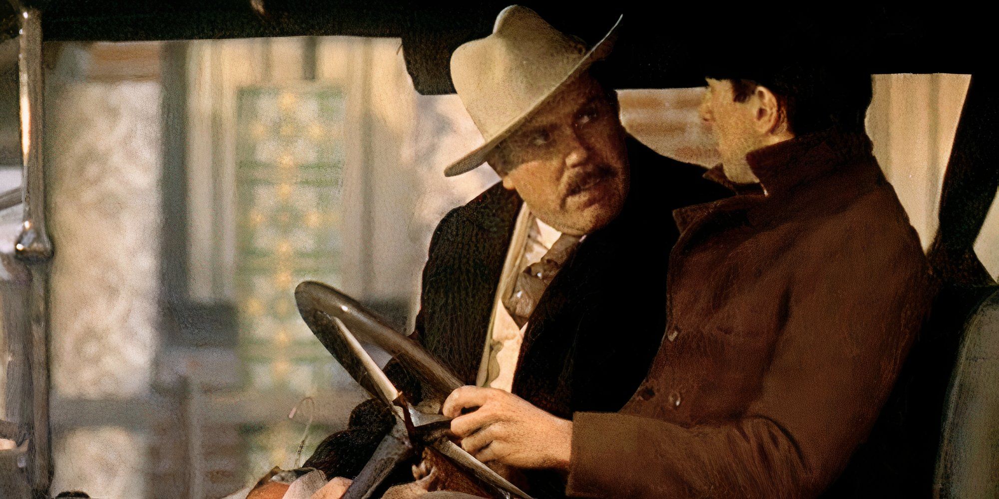 Gastone Moschin sitting in a car next to Robert De Niro who is driving in The Godfather: Part II (1974)