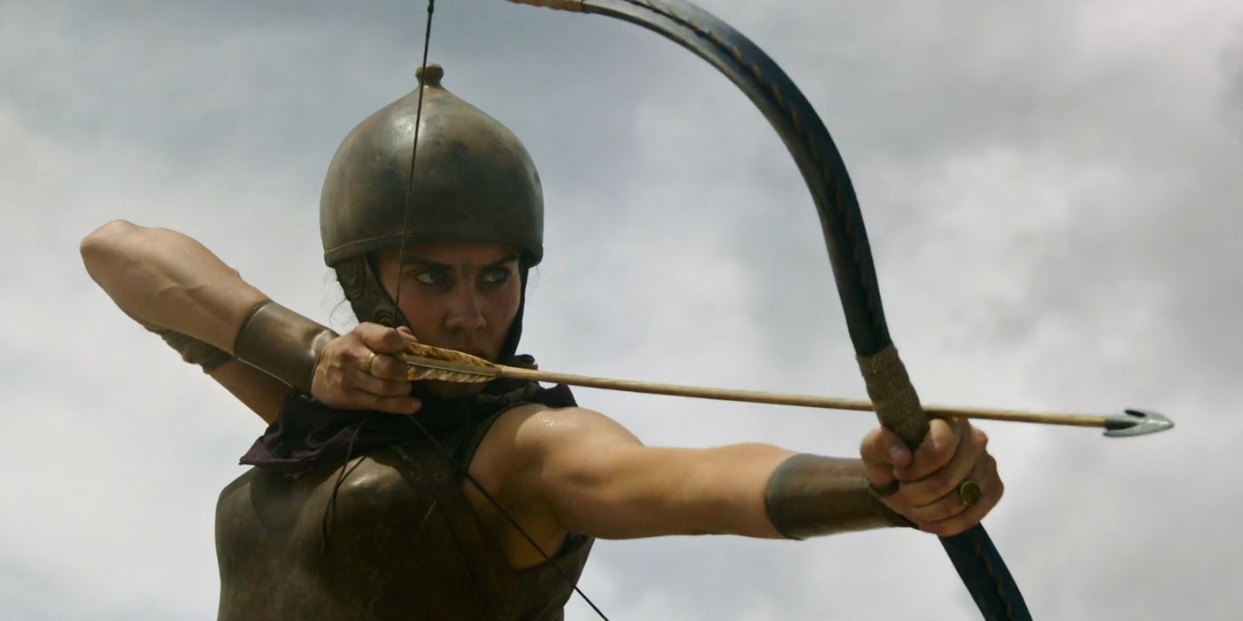 A female Roman warrior aiming her bow in Gladiator 2.