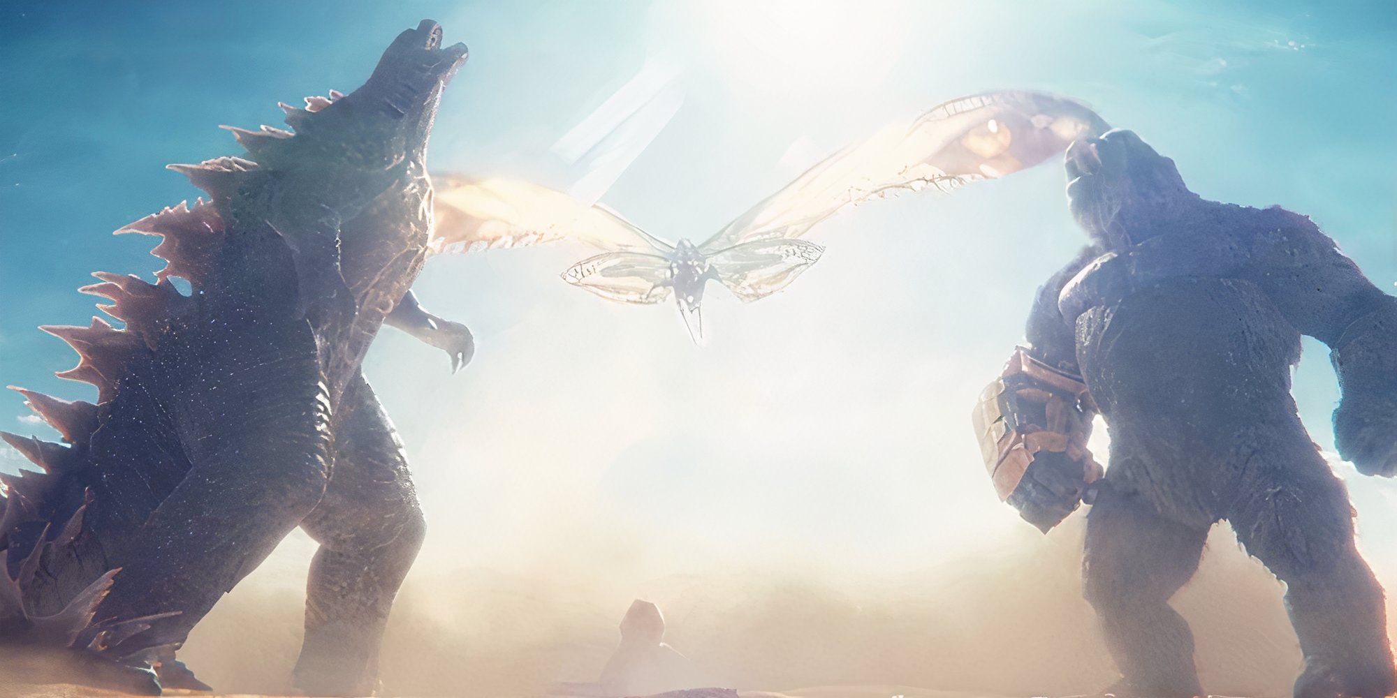 Godzilla and Kong roar together as Mothra flies between them over the Sphinx in Godzilla x Kong.