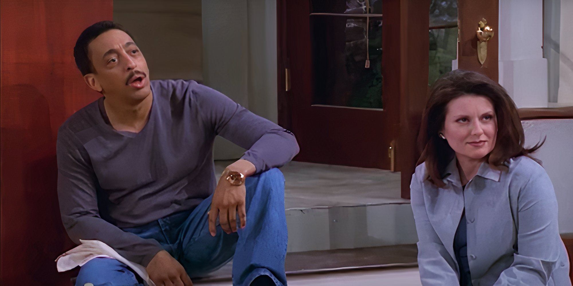 Gregory Hines sitting with Megan Mullally in Will &amp; Grace