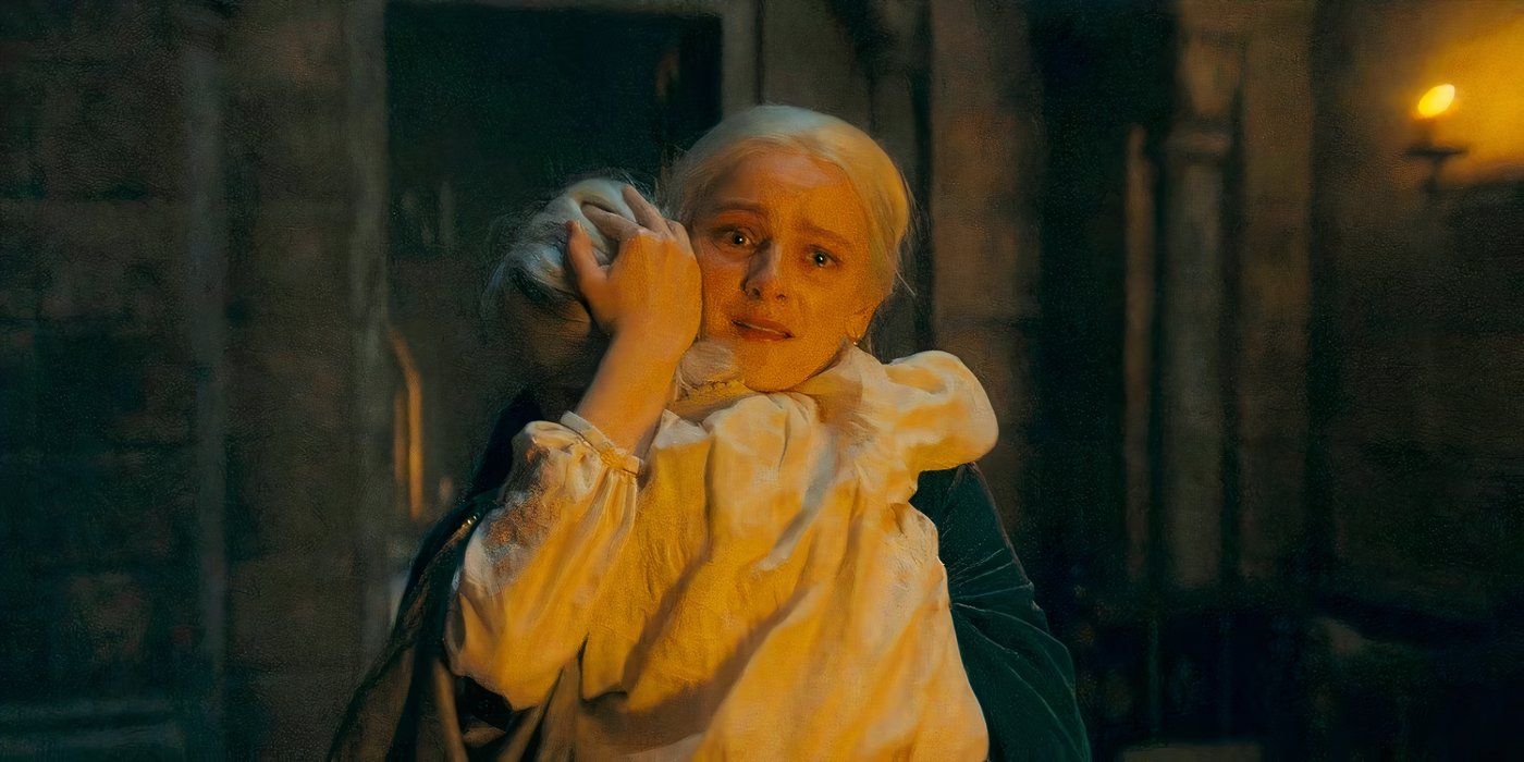 Helaena Targaryen (Phia Saban) carries her young daughter and holds her close as she runs crying through the halls in Season 2 of “House of the Dragon.”