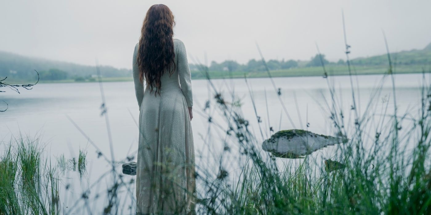 Olivia Cooke standing next to a lake in House of the Dragon Season 2 Episode 7