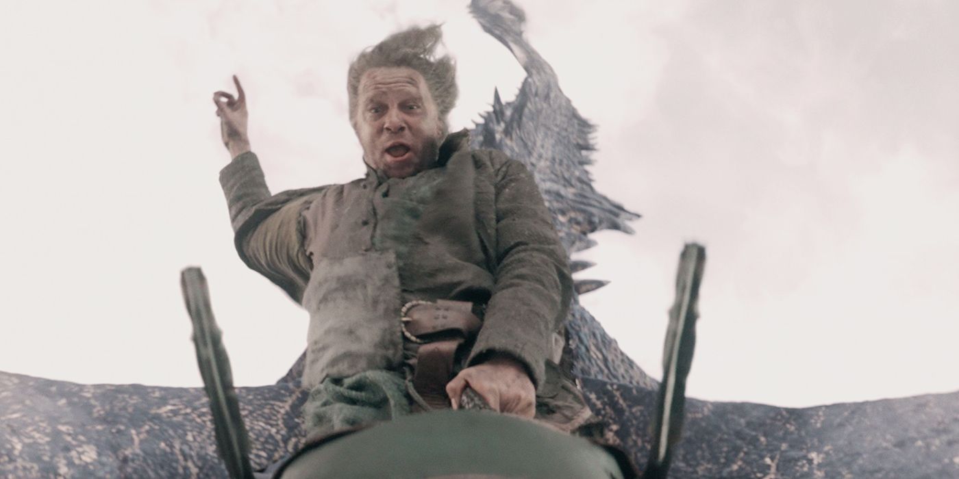 Tom Bennett as Ulf the White riding on his dragon with one hand in the air in House of the Dragon Season 2 Episode 7