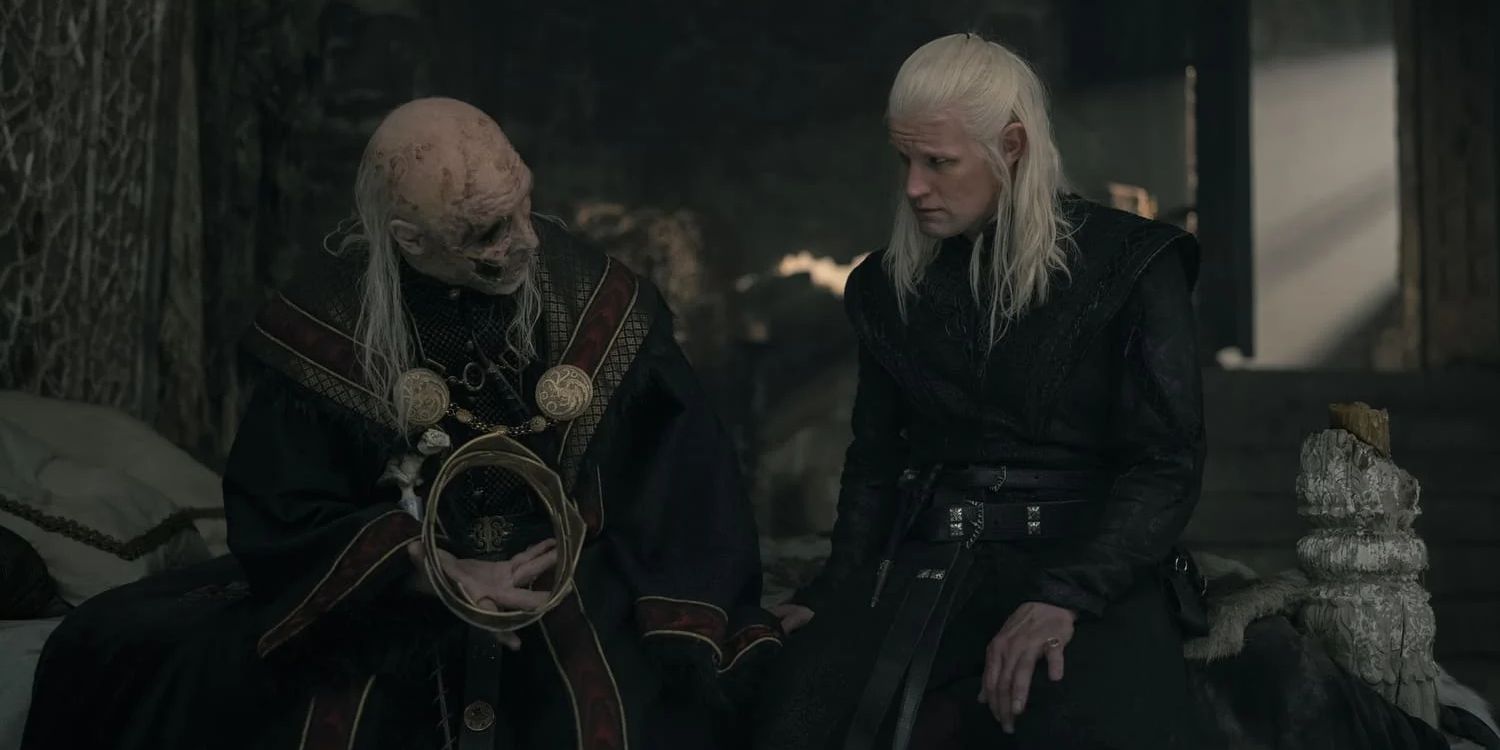 Paddy Considine as Viserys holding out the crown to Matt Smith as Daemon in House of the Dragon Season 2 Episode 7