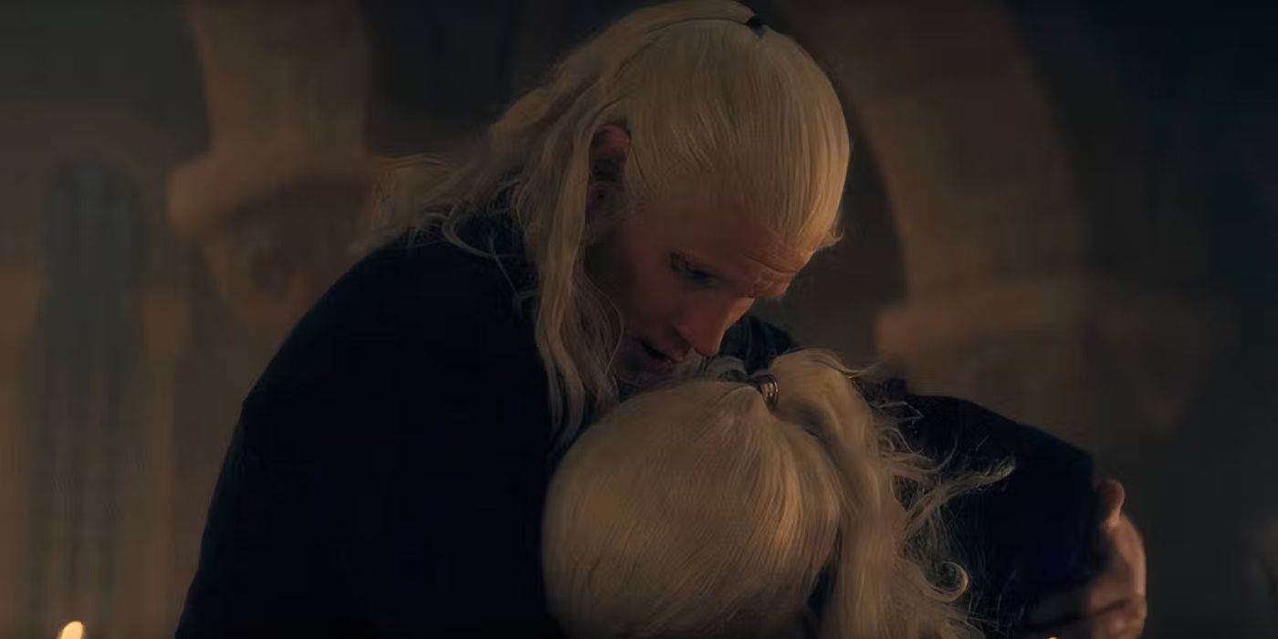 Daemon Targaryen (Matt Smith) holding a crying Viserys (Paddy Considine) in Season 2 Episode 6 of House of the Dragon