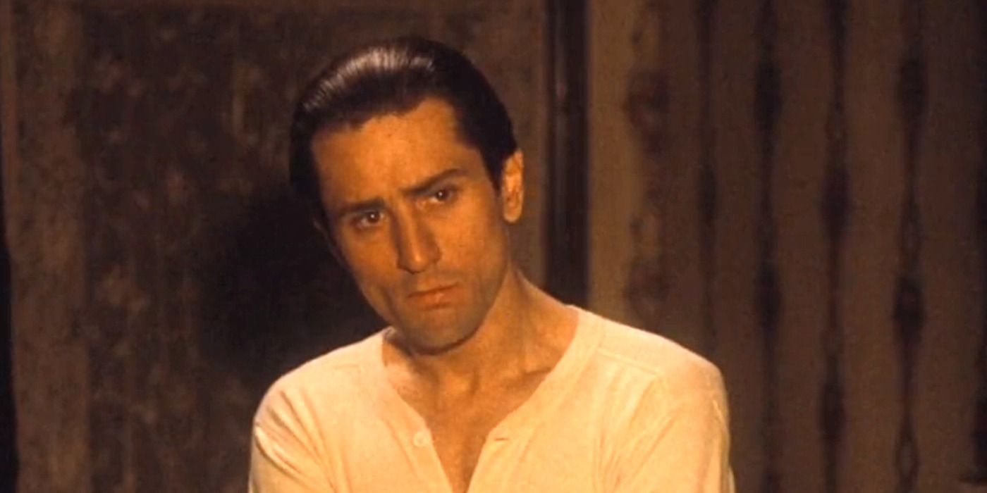 Robert De Niro as a young Vito Corleone looking at a person offscreen in The Godfather Part II