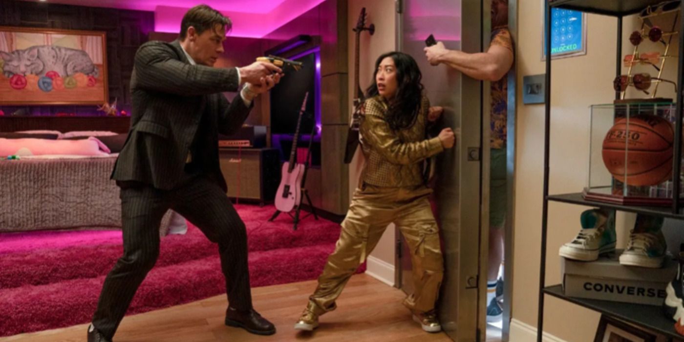 Awkwafina and John Cena hiding behind a door in 'Jackpot!'