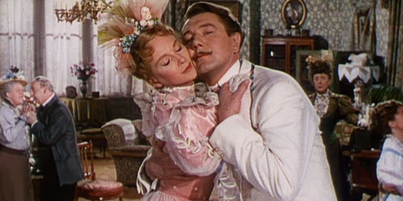 Jack Worthing (Michael Redgrave) embraces Gwendolene Fairfax (Joan Greenwood), with each person's cheek touching the other.