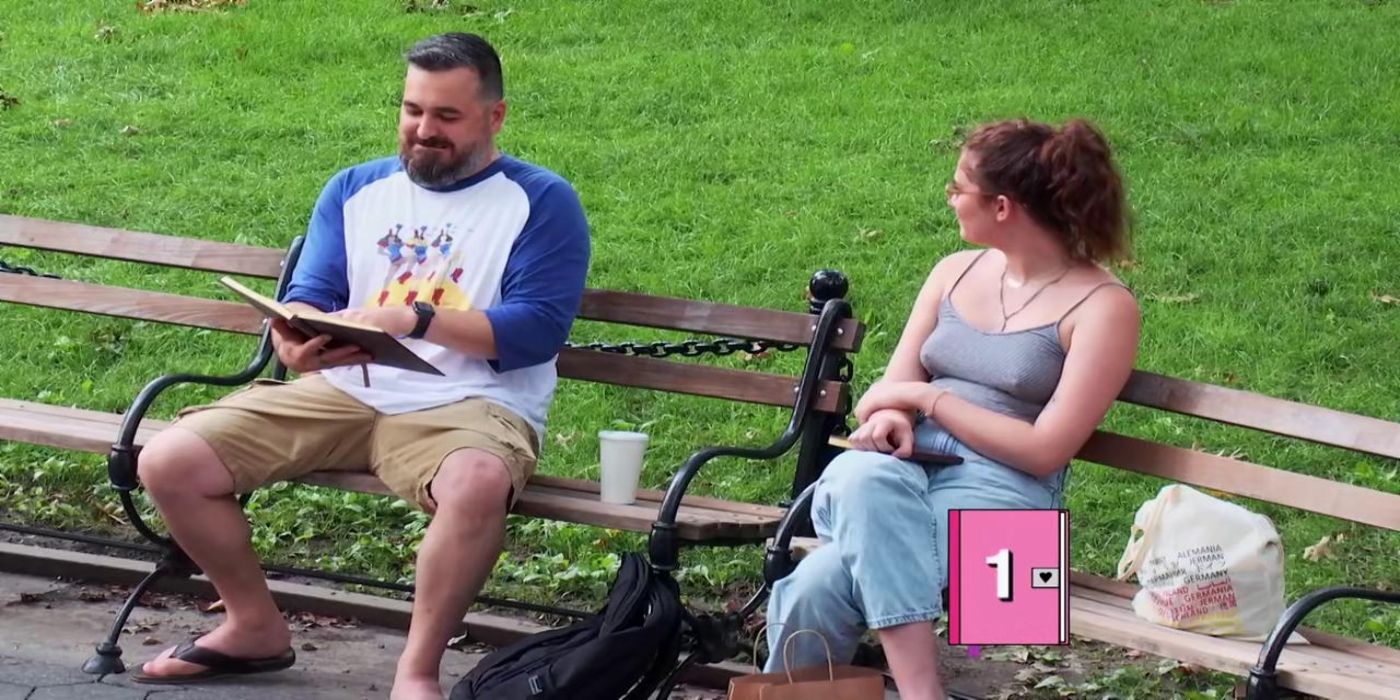 Image of Brian "Q" Quinn sitting on a park bench beside a woman who is looking at him on Impractical Jokers.