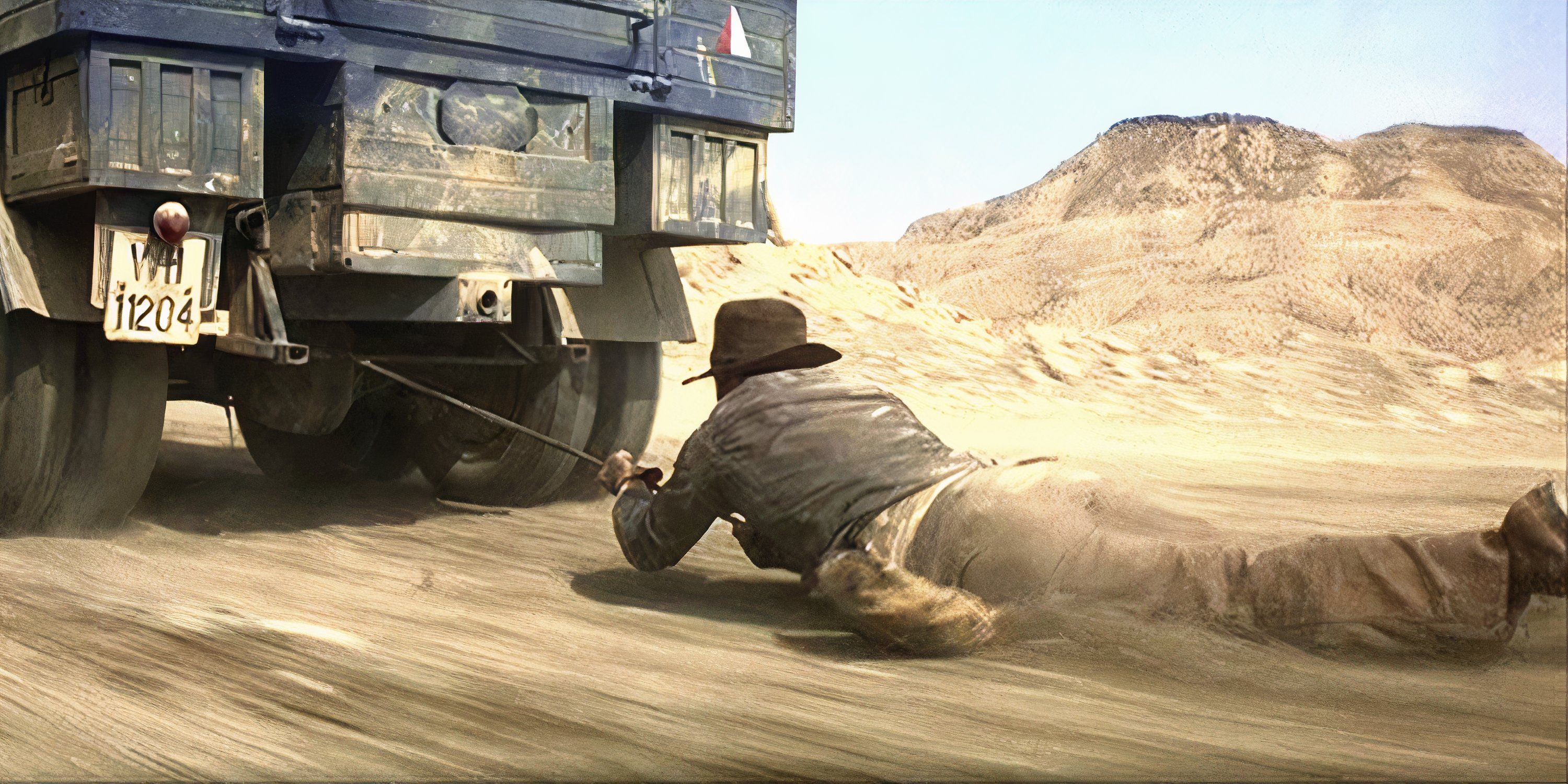 Indiana Jones being pulled by a car in Raiders of the Lost Ark