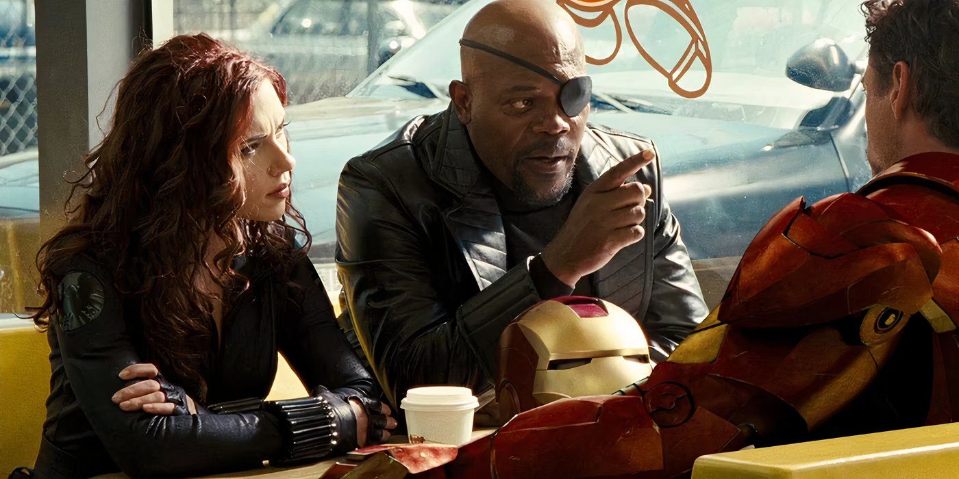 Tony Stark, Nick Fury, and Black Widow at a restaurant.
