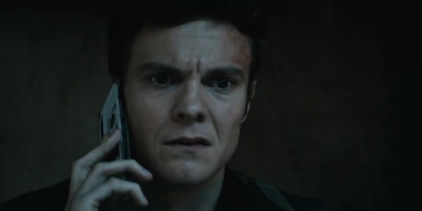Jack Quaid, looking worried while calling someone, as Hughie in The Boys Season 4 Episode 8