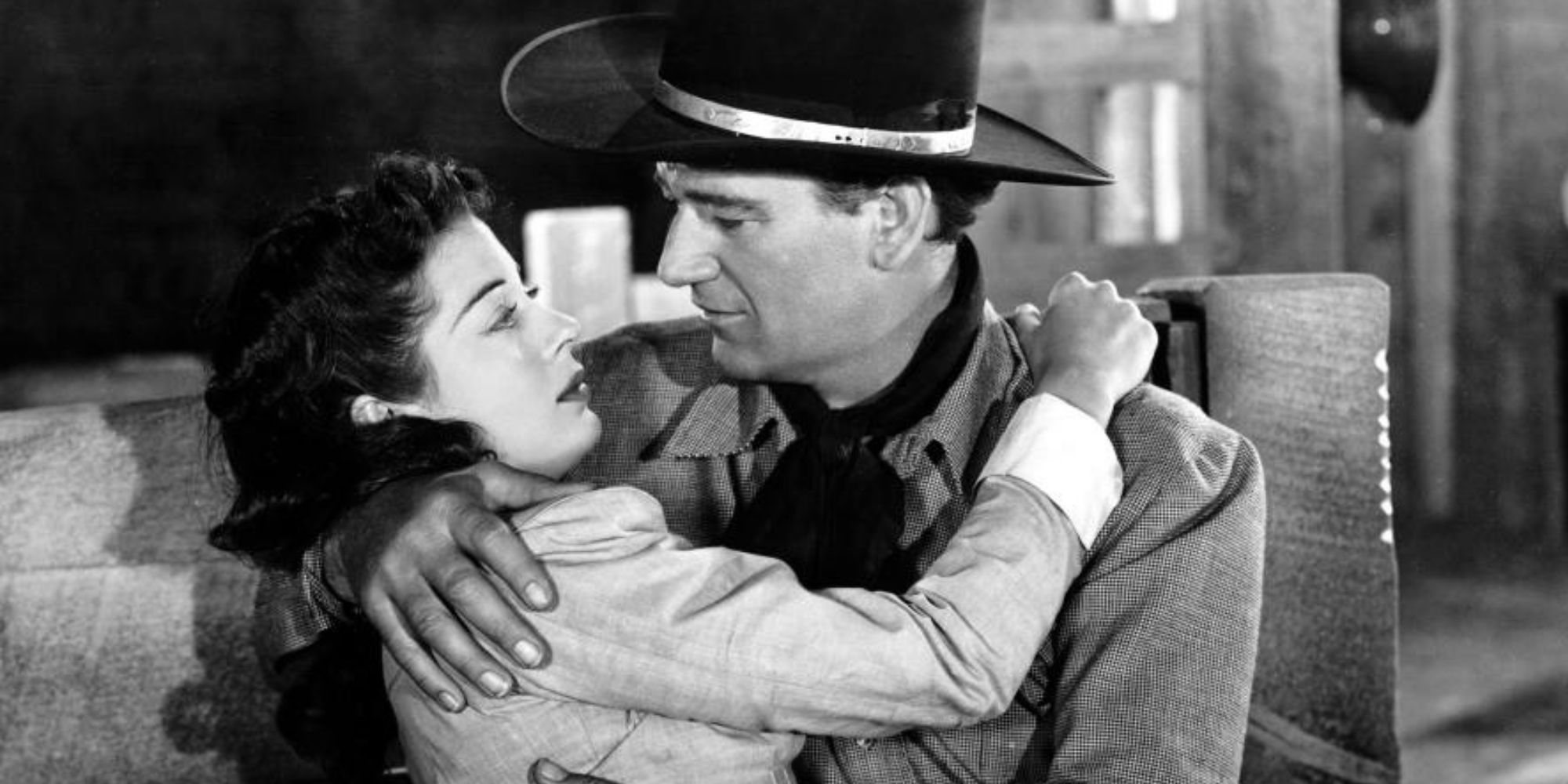 John Wayne holding Gail Russell in his arms in Angel and the Badman