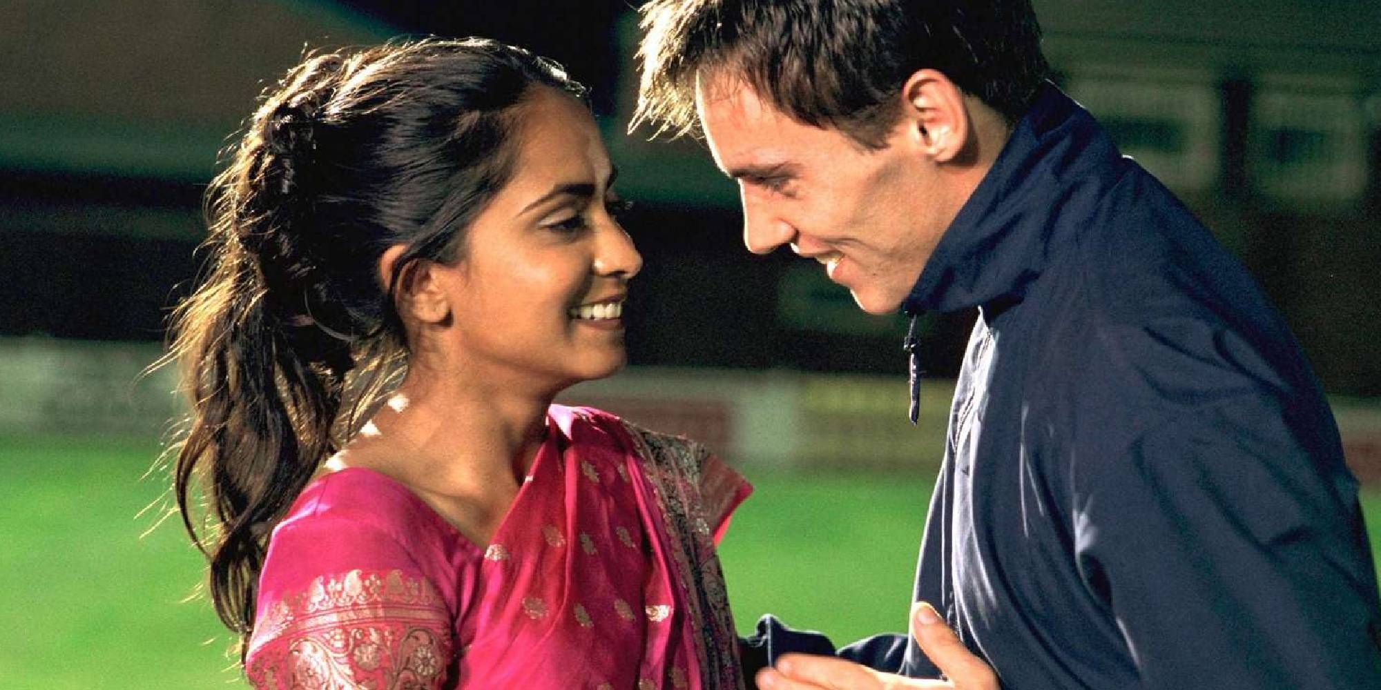Jonathan Rhys Meyers as Joe and Parminder Nagra as Jess in Bend It Like Beckham standing close to each other.