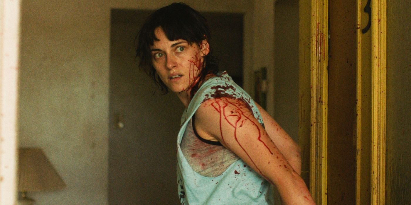 Kristen Stewart's Lou covered in blood and looking horrified in Love Lies Bleeding.