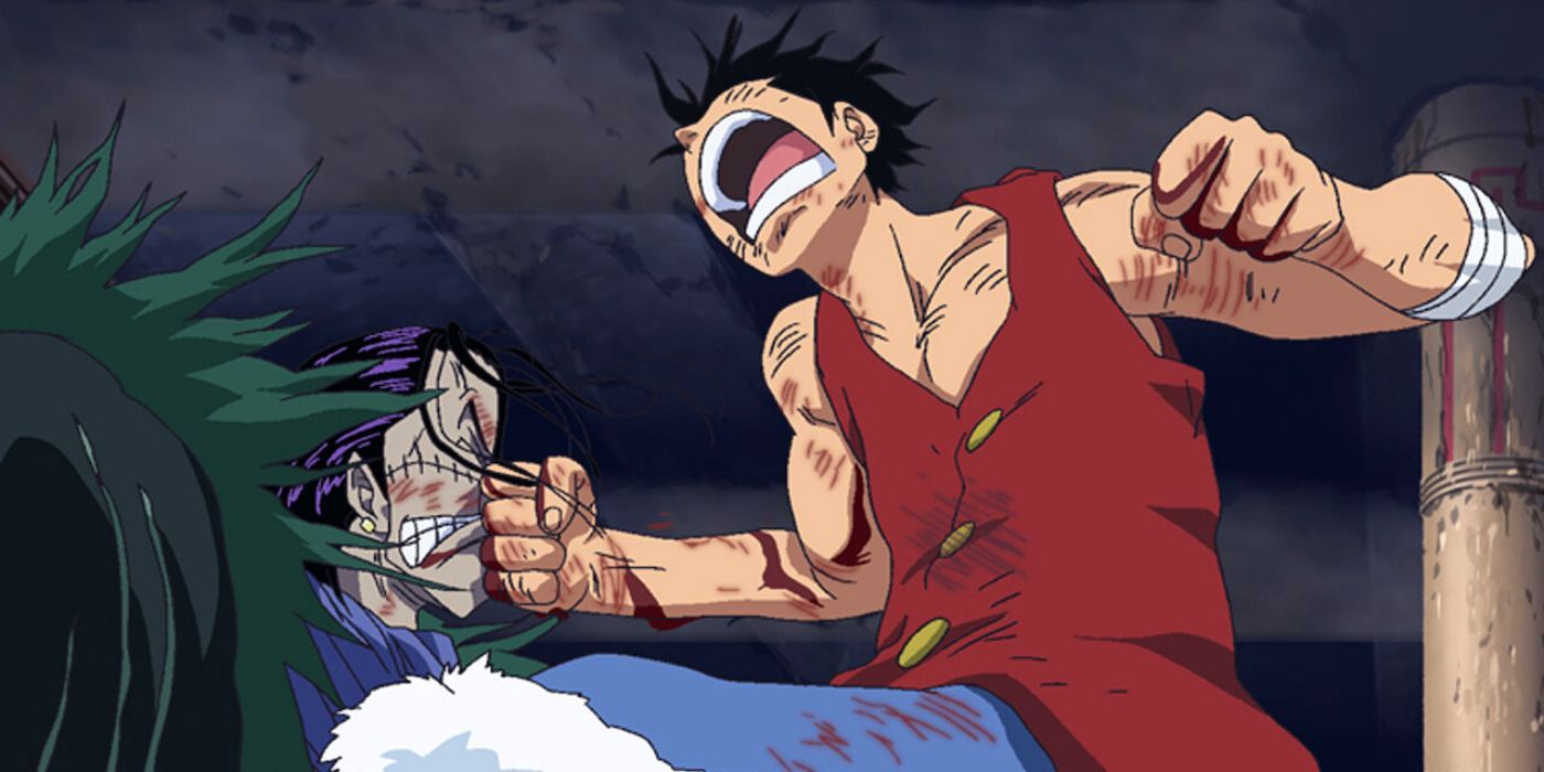 Luffy punches Crocodile in face in Alabasta in One Piece.