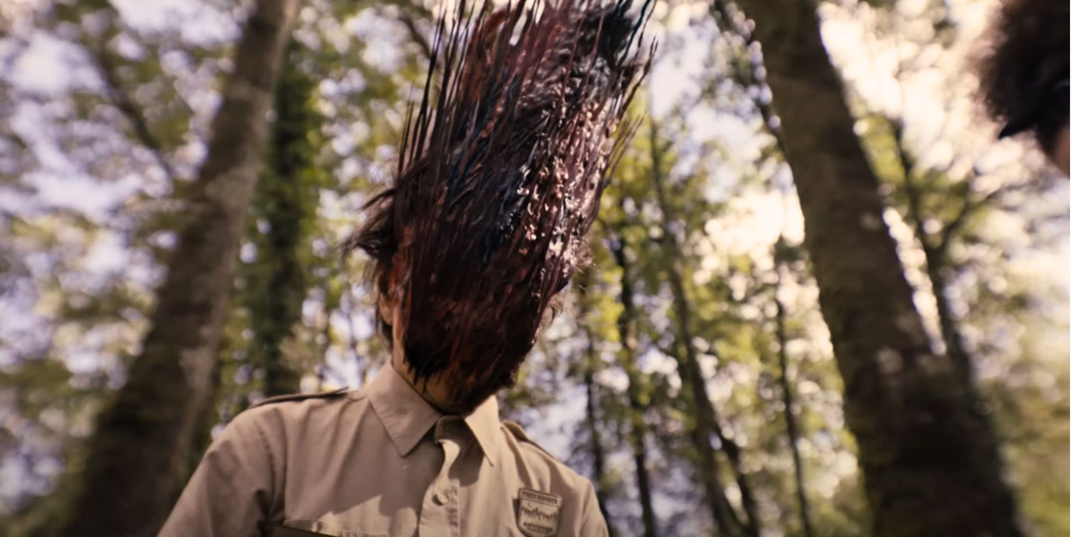 A Ranger with tree bark growing on their face in Lovely, Dark and Deep