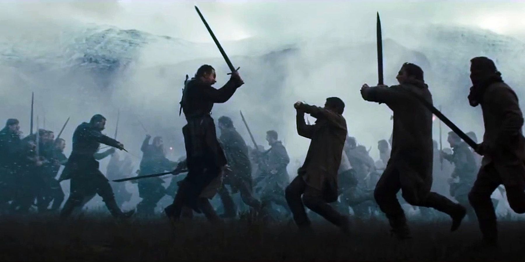 Macbeth, played by Michael Fassbender, ferociously charges into battle along with his army in Macbeth (2015).