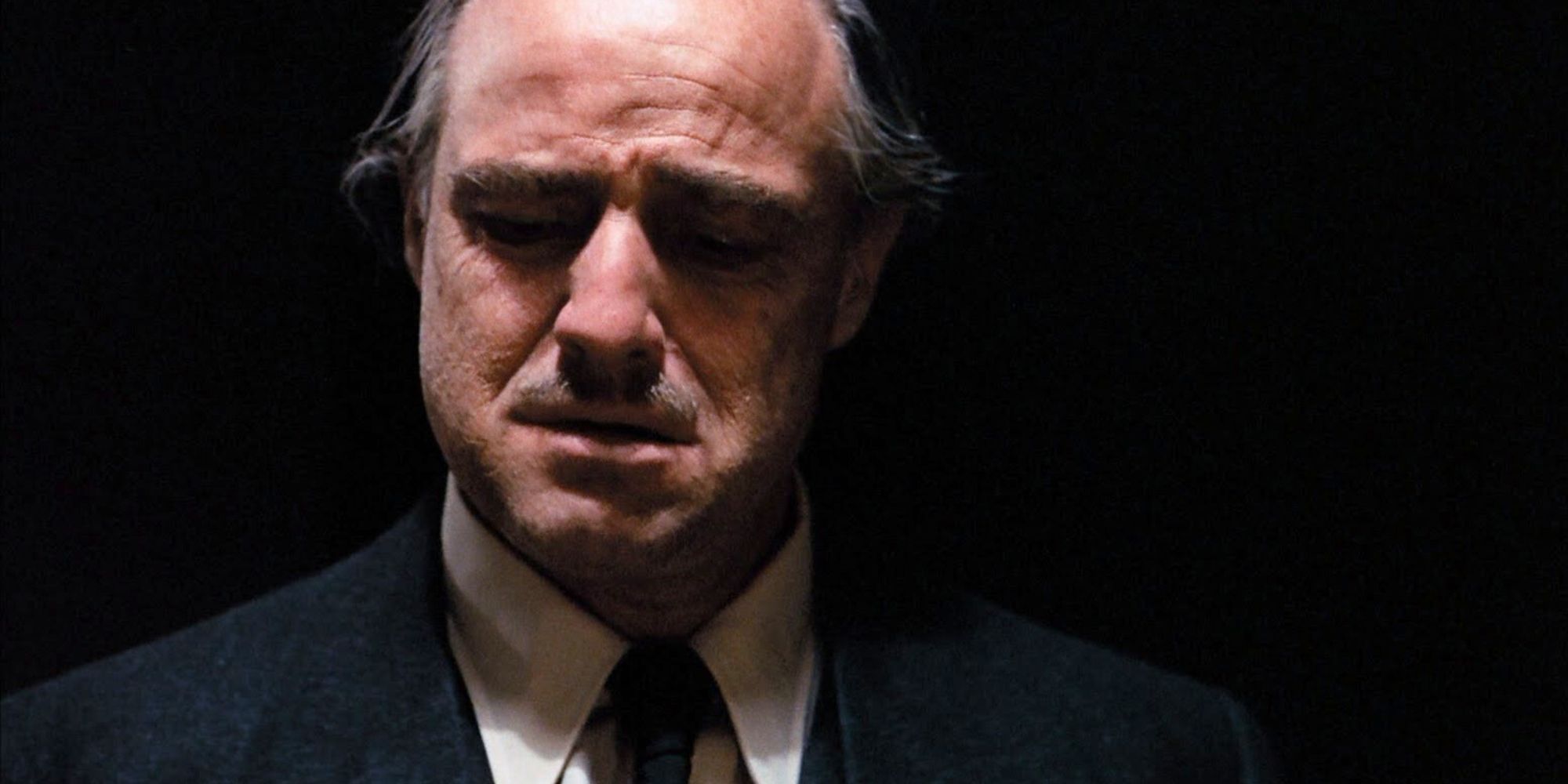 Don Vito Corleone, played by actor Marlon Brando, crying in The Godfather.