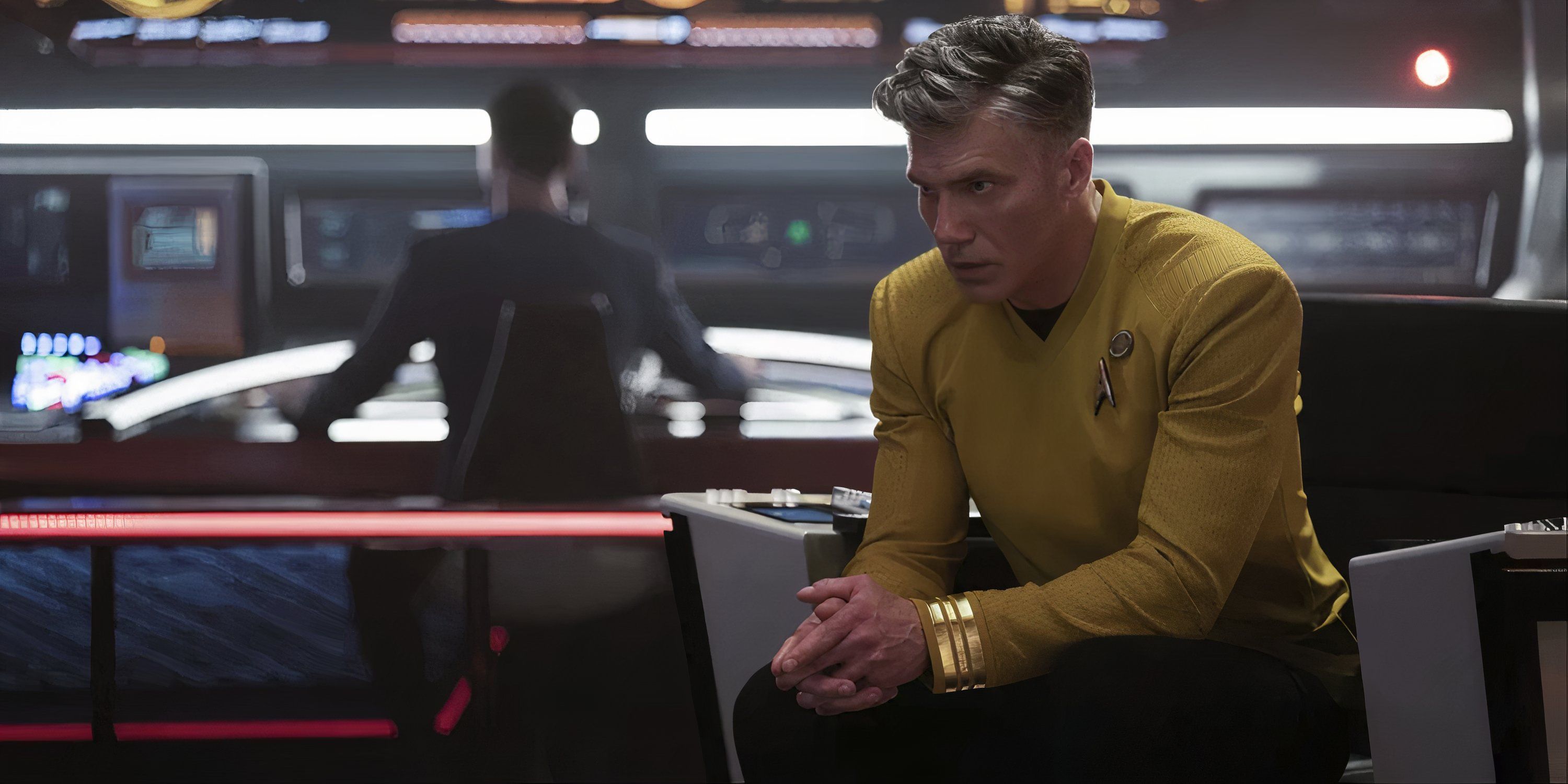 Captain Pike sitting in a chair looking serious in Star Trek: Strange New Worlds.