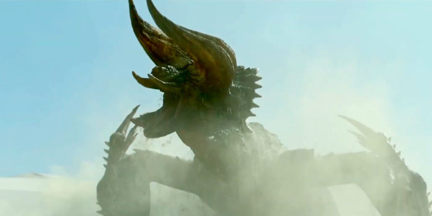A Diablos dragon bursting out of the desert sand in the film Monster Hunter