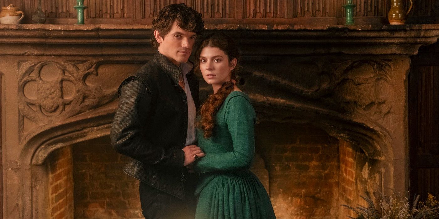 Edward Bluemel and Emily Bader standing in front of a fireplace in My Lady Jane