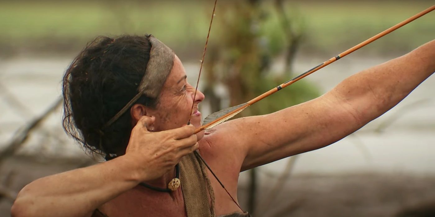 A contestant aiming her bow in Naked and Afraid: Last One Standing Season 2