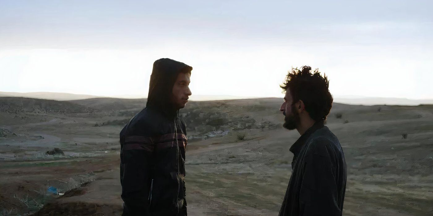Adra and Abraham look at each other with a backdrop of hills in No Other Land