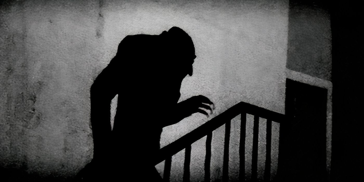 A hunched silhouette climbs up the stairs in 'Nosferatu' (1922)