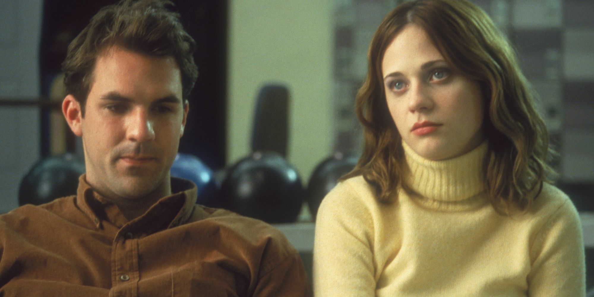 Paul Schneider and Zooey Deschanel look unhappy sitting next to each other in All The Real Girls.