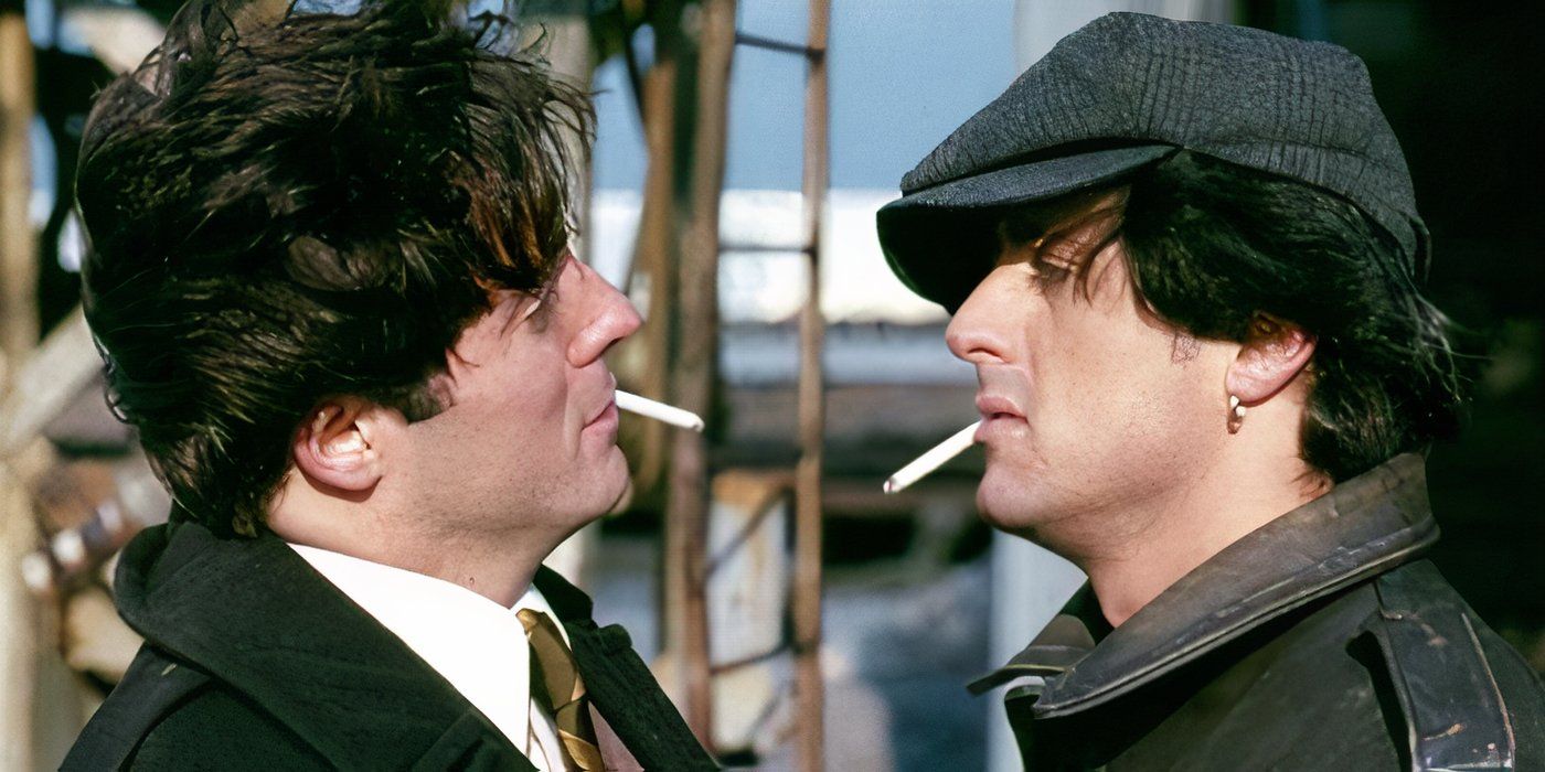 Lenny (Armand Assante) and Cosmo Carboni (Sylvester Stallone) staring each other down while smoking cigarettes in 'Paradise Alley'