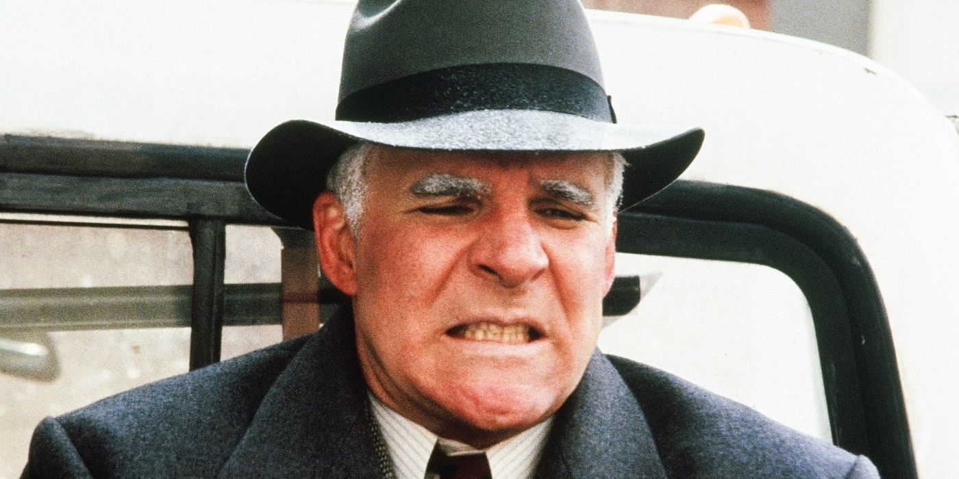 Steve Martin's Neal grimacing and shivering in Planes, Trains and Automobiles