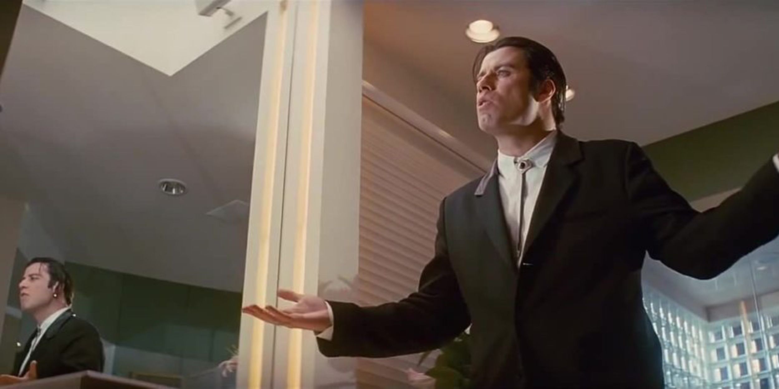 John Travolta talking to himself in a mirror in Pulp Fiction