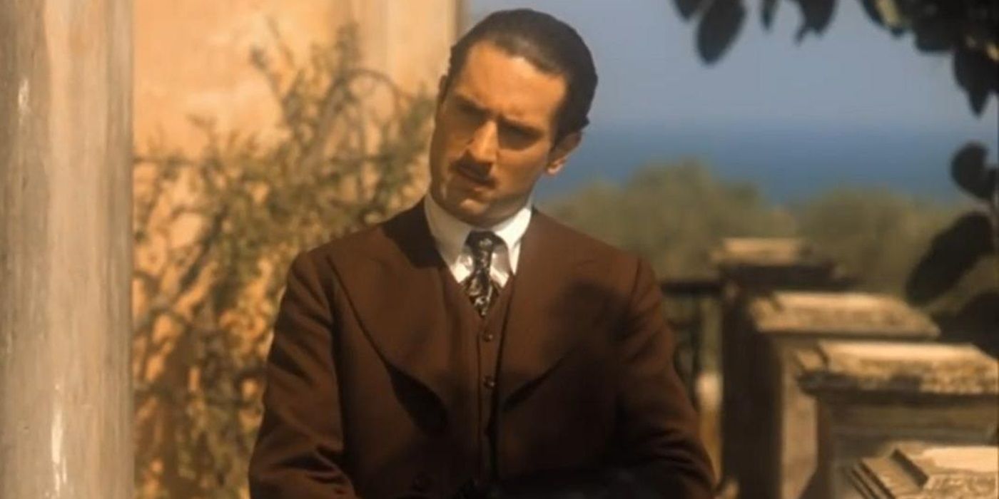 Robert De Niro as a young Vito Corleone looking at a person offscreen in The Godfather Part II