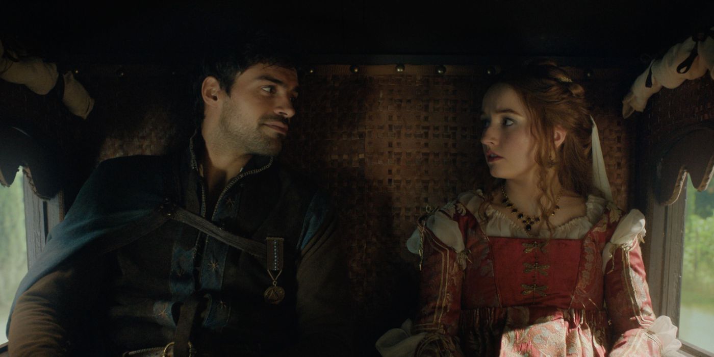 Rosaline (Kaitlyn Dever) and Dario (Sean Teale) sitting next to each other in a carriage, as they look into the other's eyes