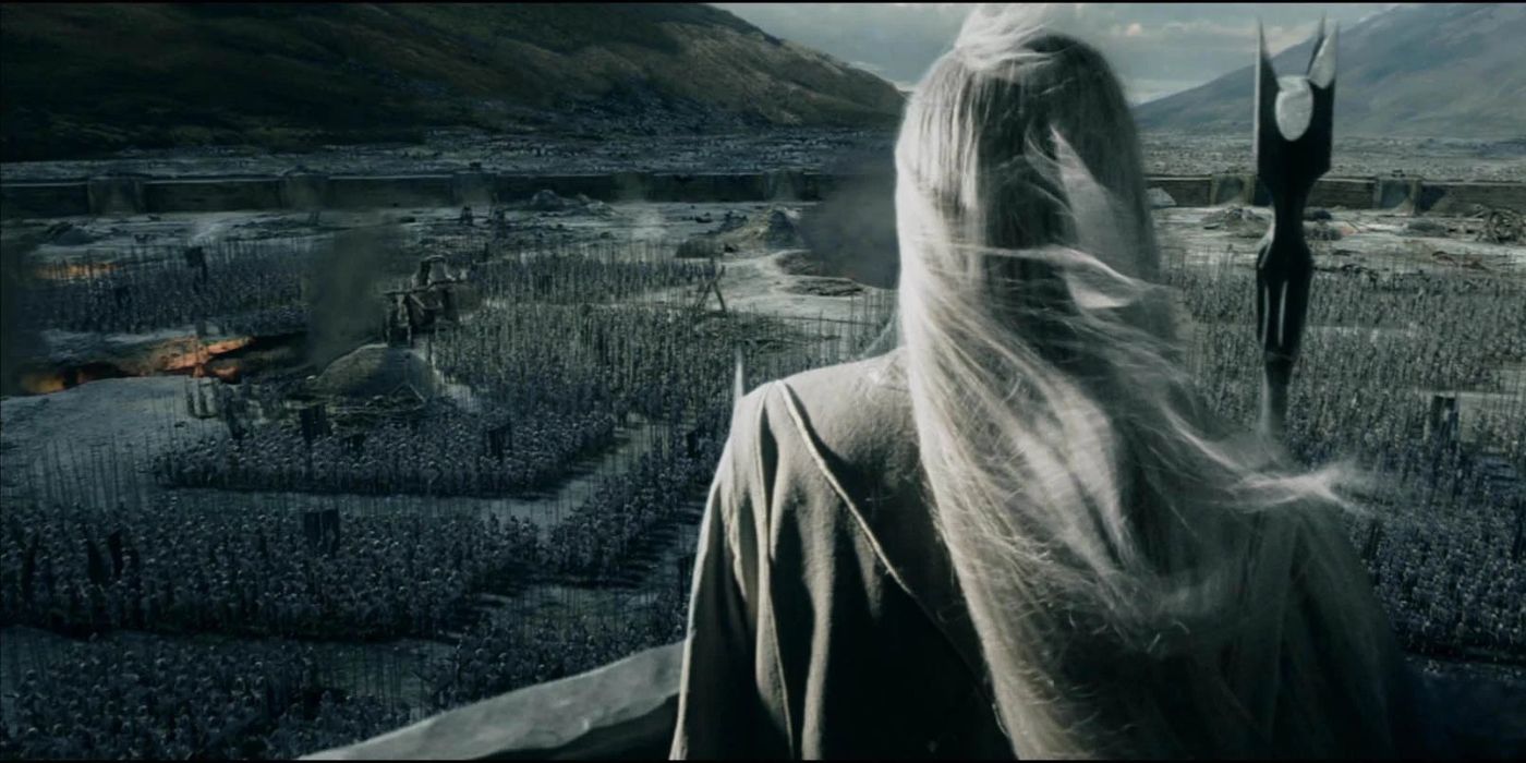 Saruman with his back to the camera addressing a large army in The Lord of the Rings: The Two Towers