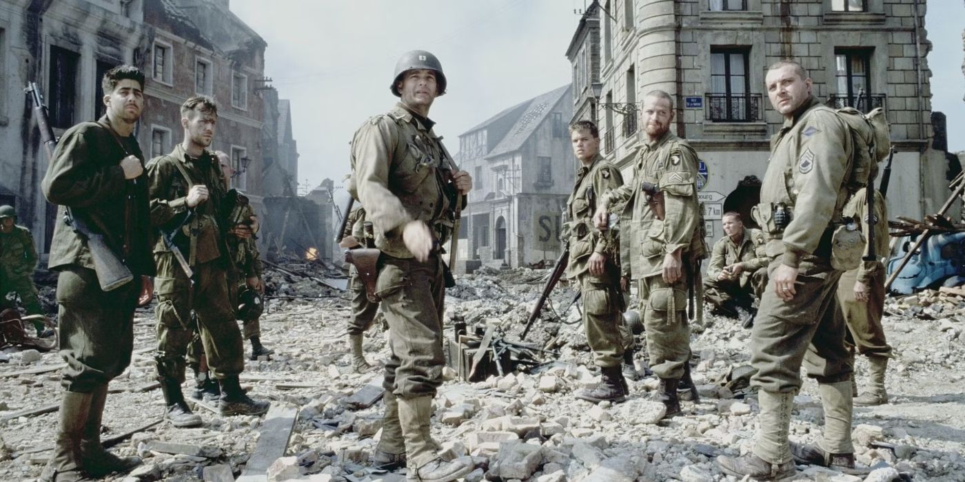 The main squad from Saving Private Ryan standing in a ruined town and look above the camera