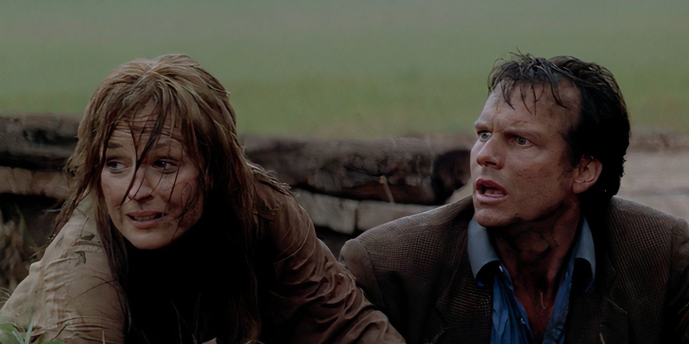 Helen Hunt and Bill Paxton dirty and shocked after a close encounter with a tornado in Twister (1996).