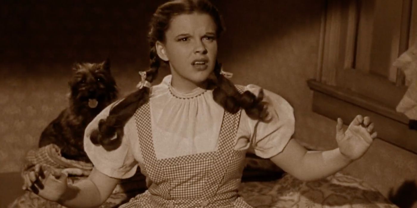 Dorothy Gale (Judy Garland) and her dog Toto get taken by a twister in The Wizard of Oz (1939).
