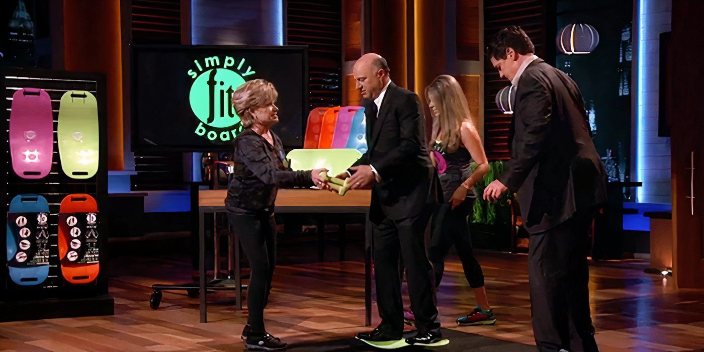 The owners of Simply Fit Board helping Kevin O&rsquo;Leary and Mark Cuban try them out during the pitch on Shark Tank.