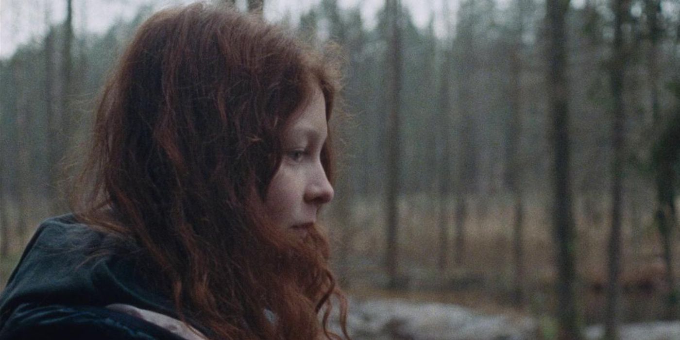 Side profile of Mia Goth in a forest in High Life