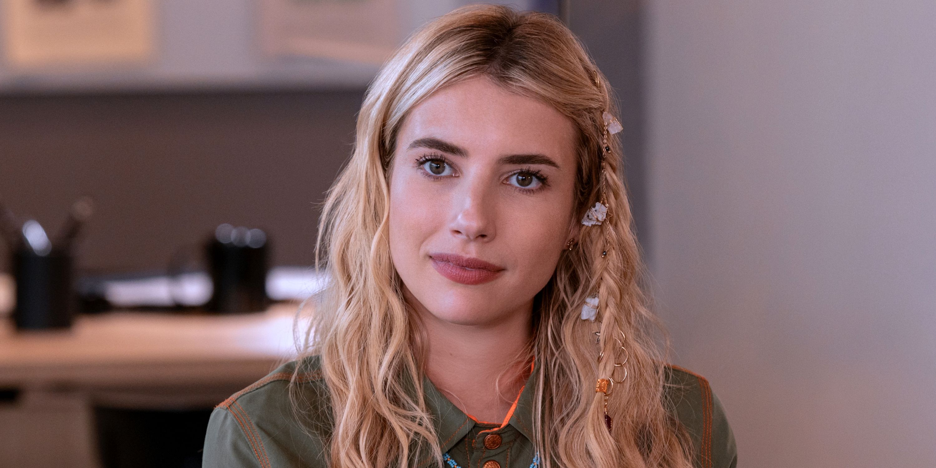 Emma Roberts as Rex looking at the camera with a small smile and her hair parted down the middle in Space Cadet