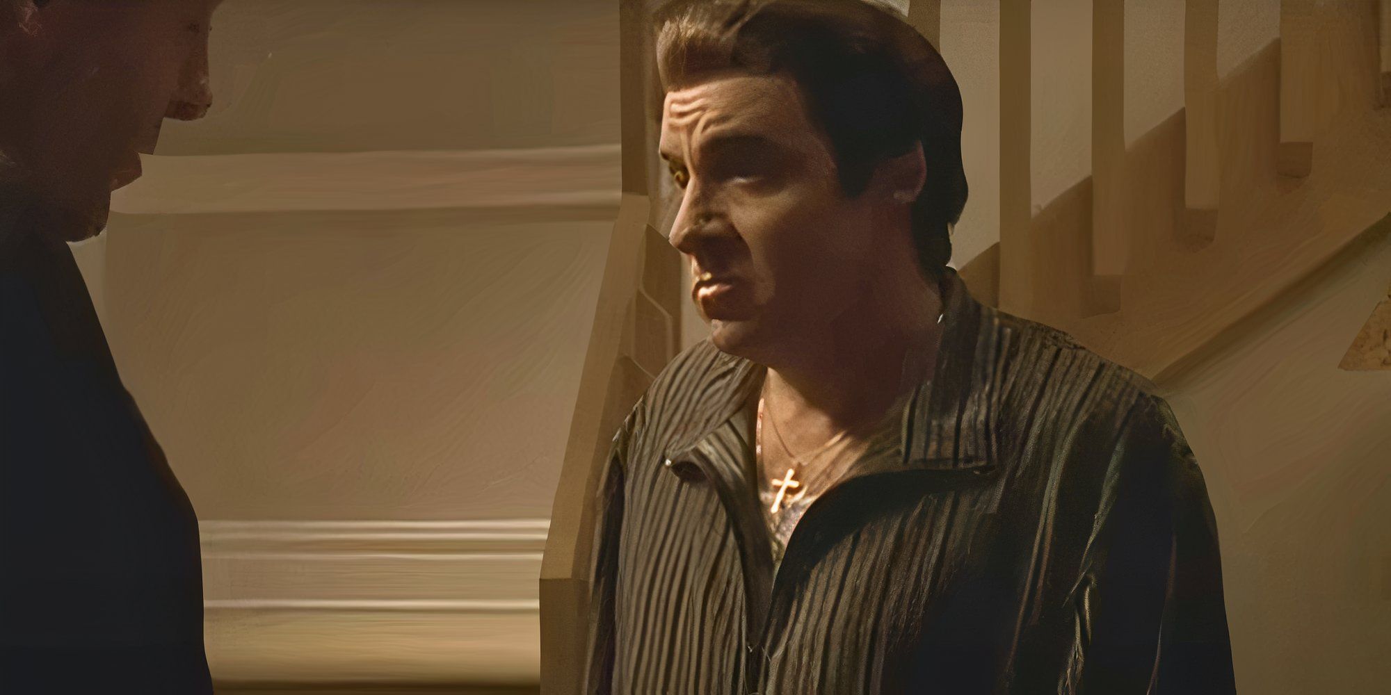 Steven Van Zandt looking at James Gandolfini standing across from him in The Sopranos