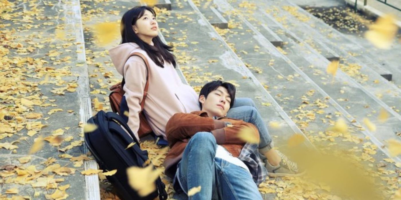 Suzy Bae sitting on stairs with Kim Woo-bin resting his head on her lap in Uncontrollably Fond.