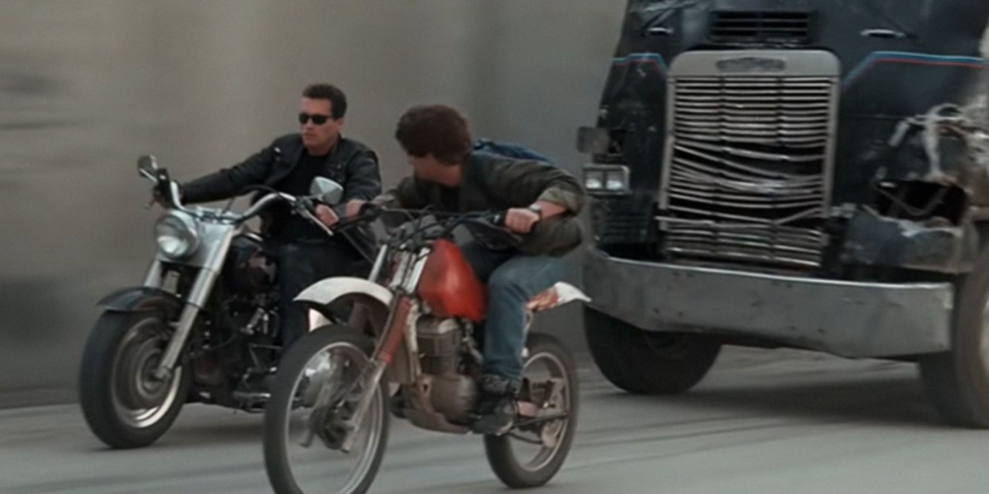 Terminator (Arnold Schwarzenegger) and John Connor (Edward Furlong) on motorbikes being chased by truck in Terminator 2 Judgement Day