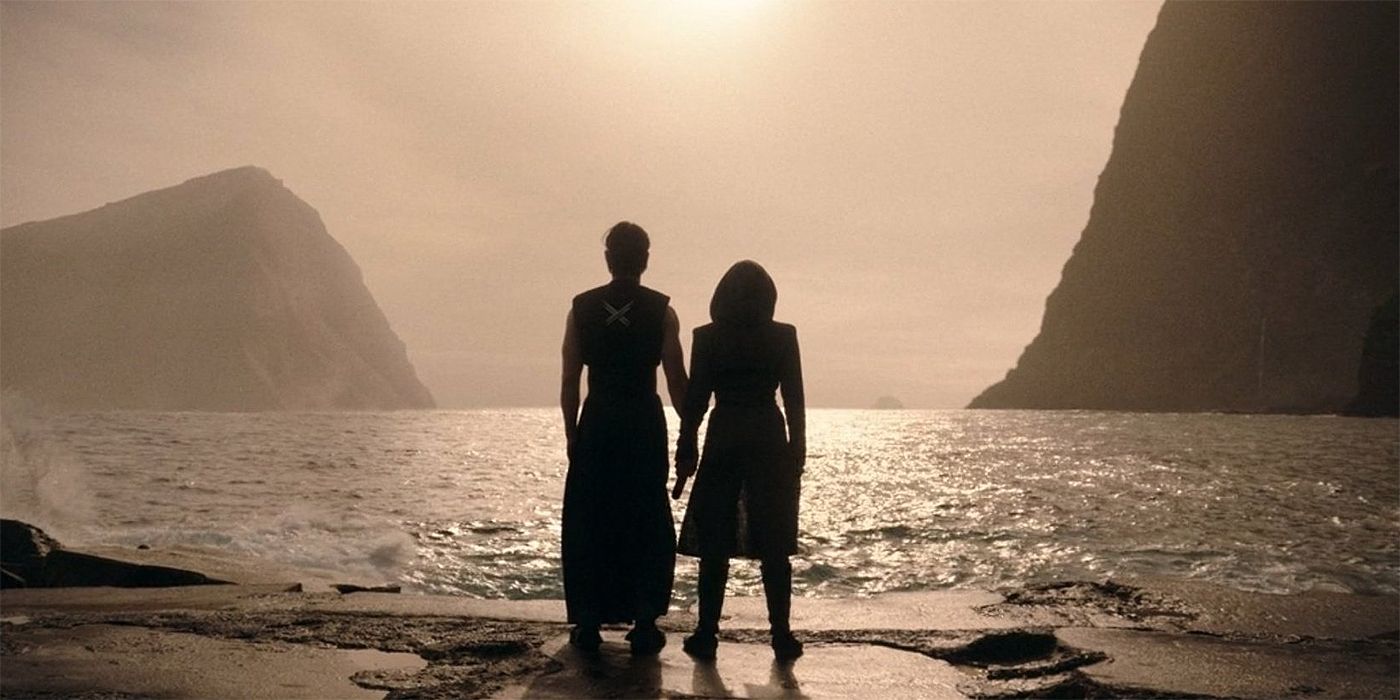 Osha and Qimir from behind, standing side by side looking at the ocean in The Acolyte finale